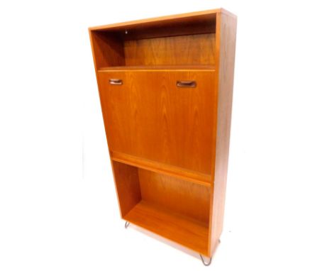 A G plan teak unit, with cocktail cabinet enclosed to the fall front, above a shelf, on hair pin legs 81cm W.