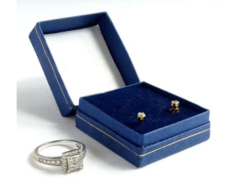 A diamond set ring, on white gold stamped 18k, the design of tiny diamonds or square design with diamond shoulders and a pair
