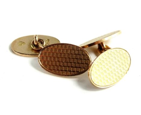 A pair of 9ct gold oval cufflinks, each with engine turned design and thin border, 11.8g.