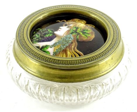 A Continental enamel plaque, decorated in the form of a maiden with long hair, wearing leaves, grapes etc., mounted into the 