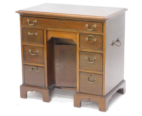 A 19thC and later mahogany kneehole desk, the rectangular top with a moulded edge above an arrangement of one long and six sh