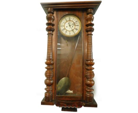 A Gustav Becker Vienna wall clock, with enamel type dial and turned pilasters, lacking crest etc., 93cm H. 