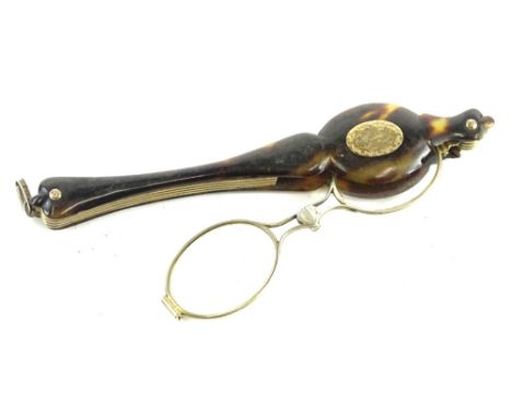 A tortoiseshell and gilt brass lorgnette, with yellow metal cartouche, engraved with a monogram. (AF) 