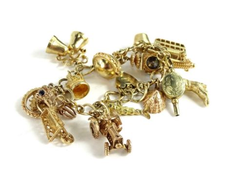 A 9ct gold charm bracelet, with fourteen charms and padlock, each charm stamped 375 or fully hallmarked 375, to include fish,