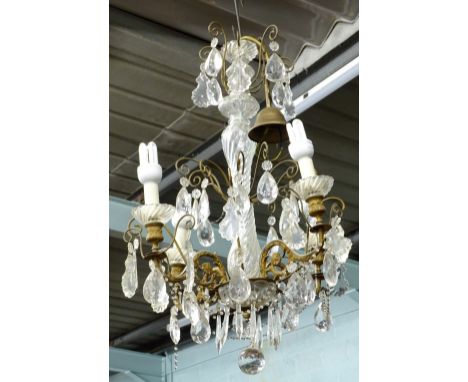 A cut and moulded glass chandelier, with four gilt metal shaped branches etc., 69cm H.