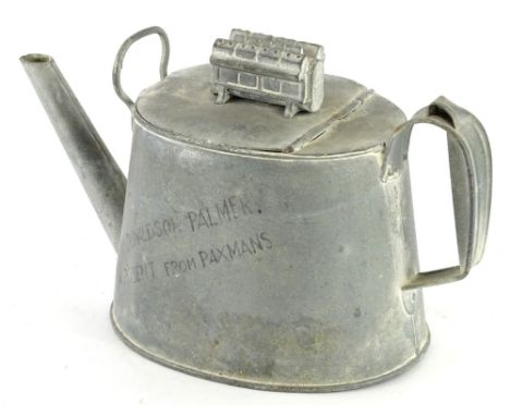 An unusual galvanised watering can, the hinged lid applied with a model of an engine, inscribed to Mr Donaldson Palmer, a pre