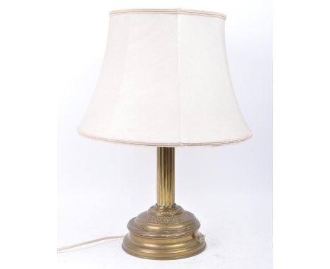 Early 20th century Edwardian brass column lamp base with shade. Lamp with brass stepped plinth base and column body. Large cr