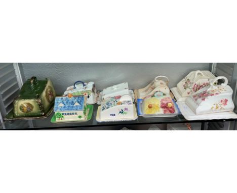 SHELF OF VICTORIAN AND 20TH CENTURY CHEESE WEDGES AND COVERS INCLUDING CROWN DEVON AND POOLE EXAMPLES 