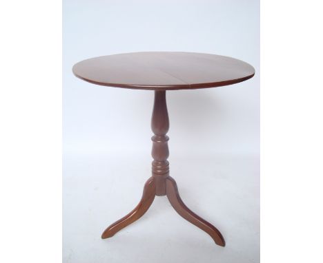 A 19th Century mahogany tripod occasional table, the circular top on baluster turned stem and cabriole legs.
61cm diameter x 