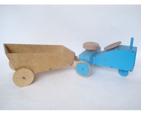 A childs scratchbuilt toy tractor and trailer. 