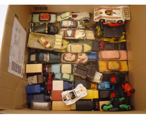 A selection of playworn Dinky, Corgi and other toy cars. 