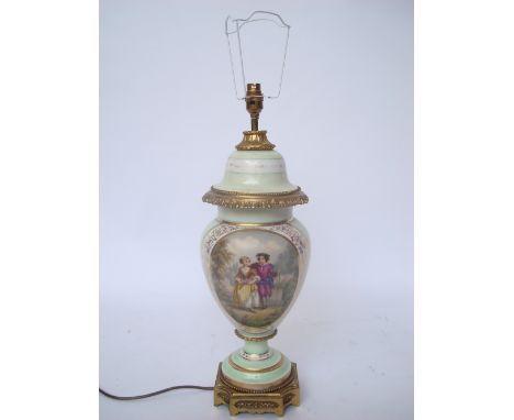 A late 19th Century French Sevres style gilt metal mounted porcelain vase and cover fitted as a table lamp, of baluster form 