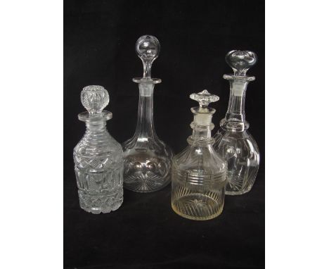 An early 19th Century cut glass spirit decanter and stopper together with a mallet shaped double ring decanter cut with broad