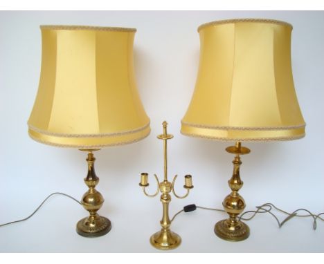 A pair of brass table lamps and shades and a twin light table lamp. 