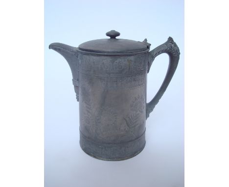 A late 19th Century American Aesthetic movement Meriden pewter pitcher, with ceramic liner. 