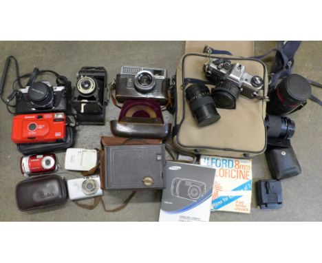 Cameras; Praktica BCX with lenses and bag, Olympus OM10 with two lenses and flash unit, a Minolta camera, a box camera and ot