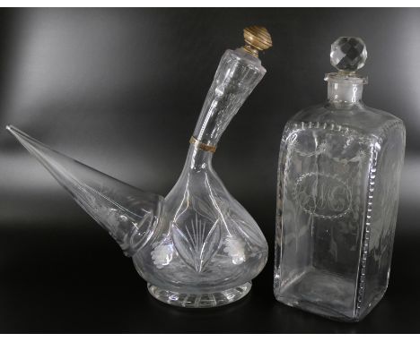 An oversized spirit decanter engraved with flowers and foliage, and a sangrilla carafe 