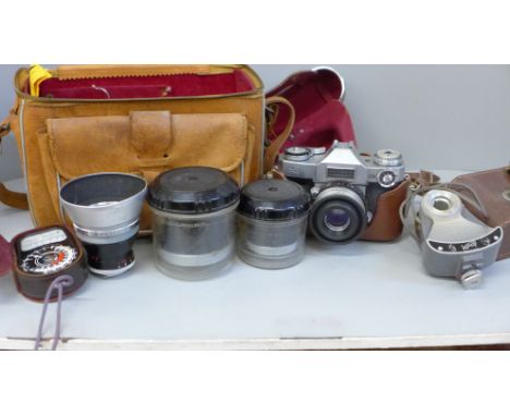 A Zeiss camera, model 207512, in leather case, with pro-Tasser 1:4 f=35 lens, another 36591217 f=115 and f=85, flash attachme