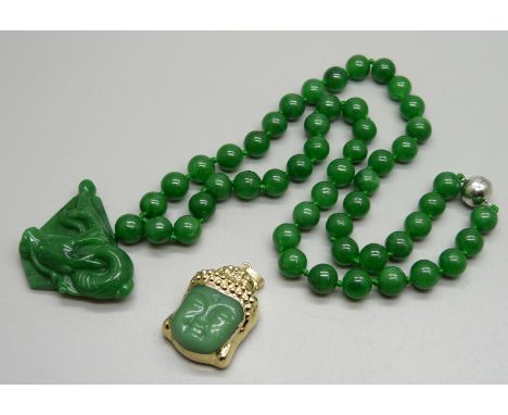 A jade style bead necklace with dragon pendant and a Buddha pendant 