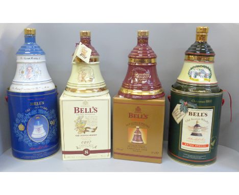 Four Wade Bell's Whisky decanters; three Extra Special and Royal commemorative 