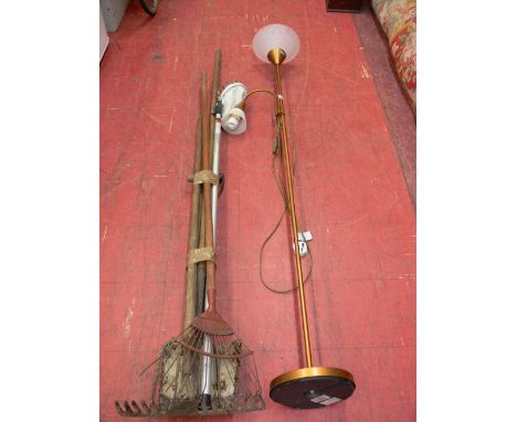 Bundle of long handled garden tools and a modern standard lamp E/T