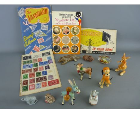 Mixed box of collectables including a Wade Jumbo Drummer with others, a part filled Vanguard stamp album, various ornamental 