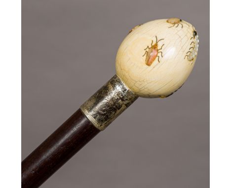 A Victorian walking stick, set with shibayama inlaid ivory handle.  87.5 cm long.  CONDITION REPORTS:  