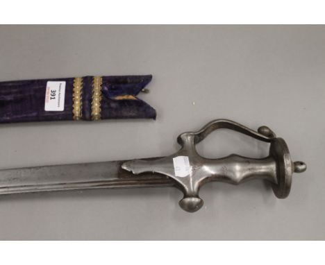 An 18th/19th century Tulwar, 95 cm long, with later scabbard.