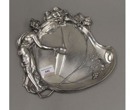 An Art Nouveau W.M.F silvered pewter dish depicting a young maiden at a well filling a ewer, fully marked and numbered. 28 cm