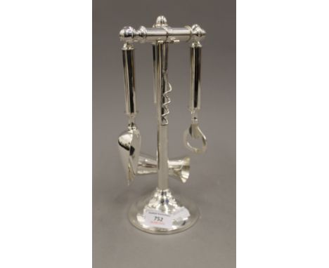 A silver plated bar tool set. 27.5 cm high.