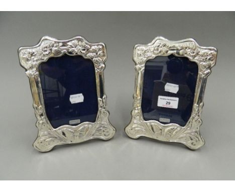 A pair of Art Nouveau style silver photograph frames. 20.5 cm high.