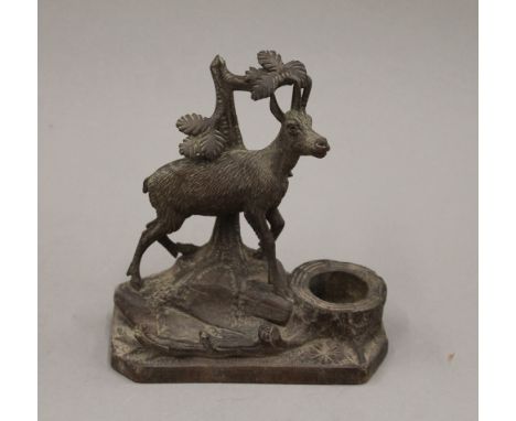 A Black Forest carved wooden inkwell surmounted with a goat. 14 cm high.