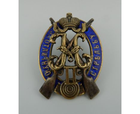 A Russian enamel decorated silver badge. 4.5 cm high.