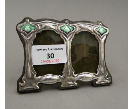 A sterling silver Art Nouveau style double photograph frame. 11 cm wide.