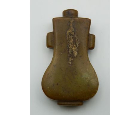 A Chinese carved jade snuff bottle of flattened form, possibly 19th century. 6.5 cm high.