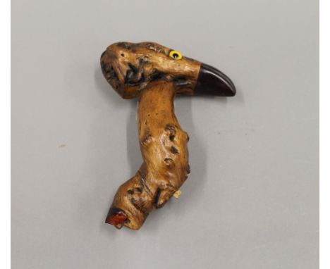 An unusual walking stick handle formed as a bird. 