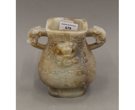A Chinese pale jade vase. 16 cm high.