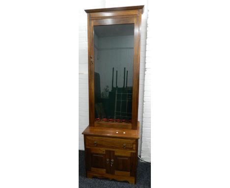 A modern mahogany gun cabinet. 201 cm high.