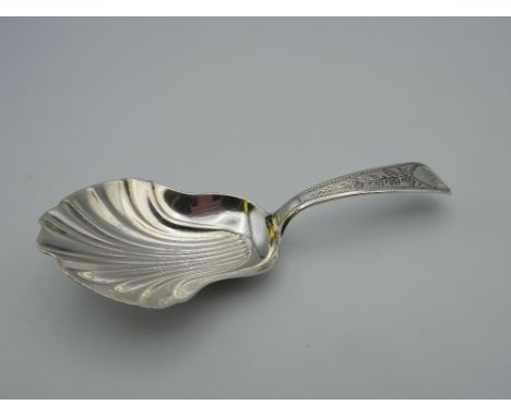 A George III silver caddy spoon. 8.5 cm long (11.8 grammes)