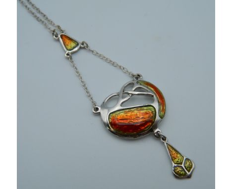 An Art Nouveau style silver enamel pendant. 4.5 cm high.