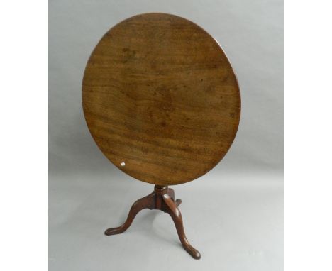 A George III mahogany tilt-top tripod table. 89 cm diameter.