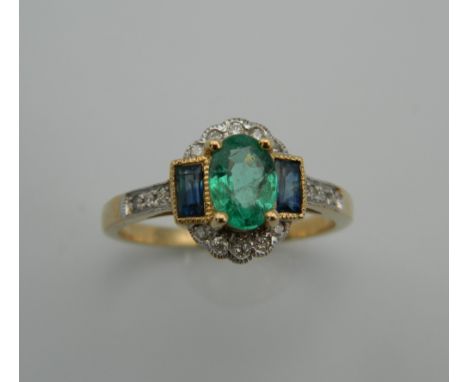 An Art Deco style 9 ct gold emerald, sapphire and diamond ring. Ring Size N/O.