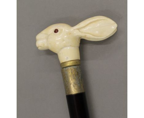 A walking stick with a carved bone handle formed as a rabbit. 92 cm long.