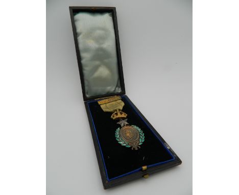 A Victorian brass and enamel medallion, dated 1837-1887, cased.