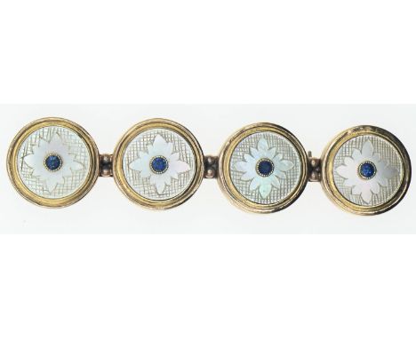 Brooch comprising of four 18ct gold, mother-of-pearl and sapphire set buttons mounted onto a 9ct gold back. Gross weight 11.1