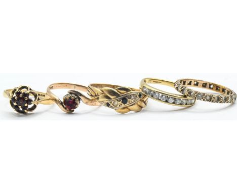 Five 9ct gold rings. Eternity ring missing one stone. Gross weight 8.07g 