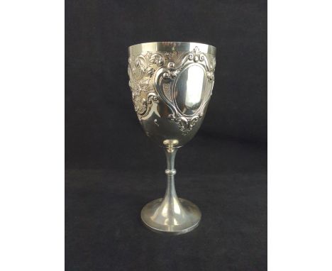 Large George V silver trophy cup, Jones & Crompton, Birmingham 1911, of chalice form, the body embossed with flowers and scro