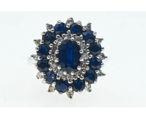 18ct white gold, sapphire and diamond triple row cluster ring.&nbsp; Size K 1/2.&nbsp; Gross weight 6.51g. total head measure