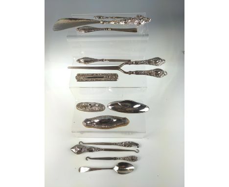 Three silver mounted nail buffers, silver handled glove stretcher, show horn, three hooks, three manicure tools, folding comb