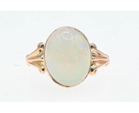 9ct gold ring set with a large oval cabochon opal (13.7mm x 10.7mm estimated). Size P/Q Gross weight 2.70g. 